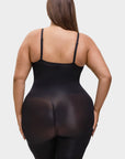 Person wearing a black bodysuit on a white background