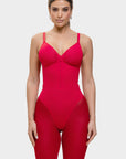 Red bodysuit worn by a model on a white background