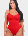 Woman wearing a red swimsuit on a white background