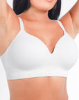 White bra worn by a person on a white background