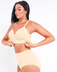 Woman wearing a yellow bikini set against a plain background