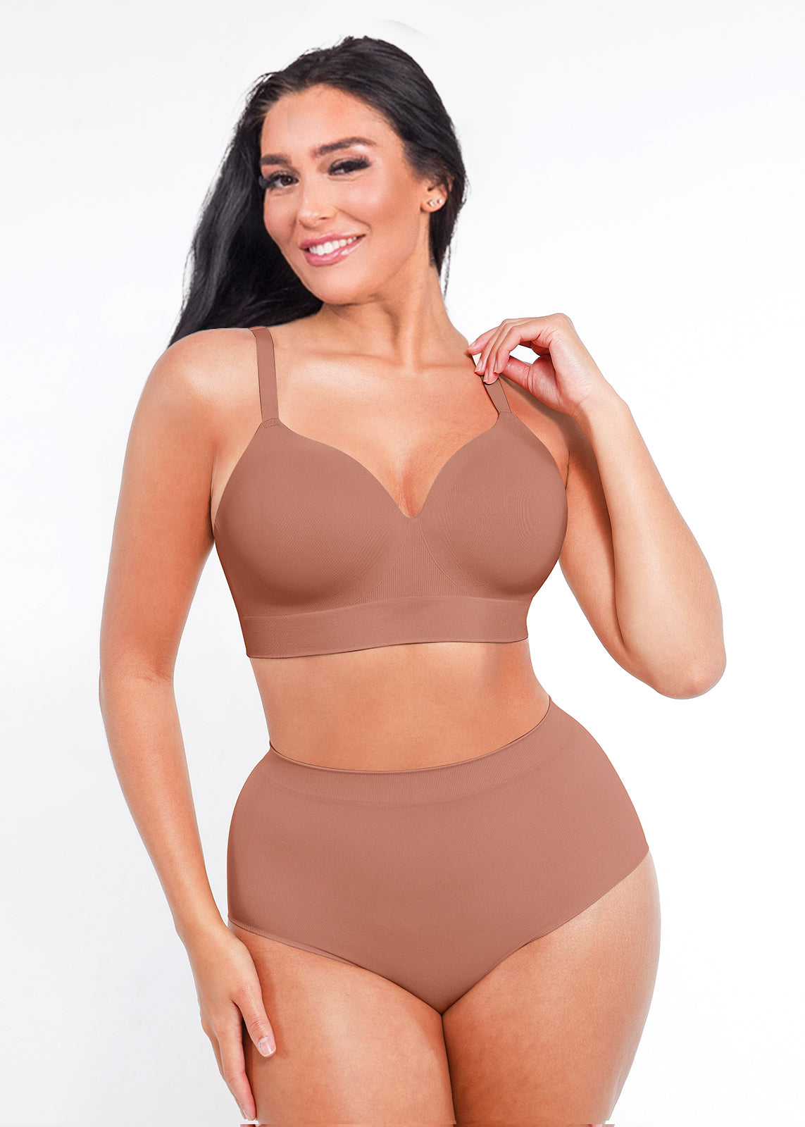 Woman wearing a brown bra and panties set on a white background